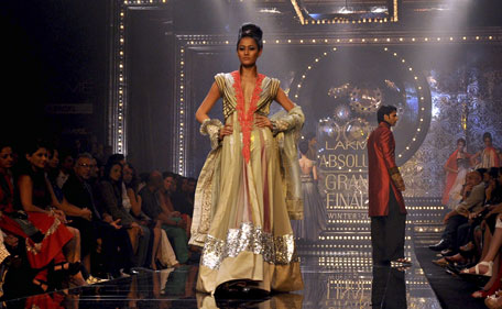 A model walks the ramp for designer Manish Malhotra during the grand finale of Lakme Fashion Week (LFW) Winter/Festival 2011 in Mumbai on August 21, 2011. (AFP)
