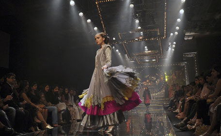 A model walks the ramp for designer Manish Malhotra during the grand finale of Lakme Fashion Week (LFW) Winter/Festival 2011 in Mumbai on August 21, 2011. (AFP)