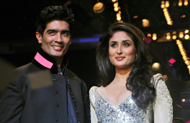 Indian Bollywood actress Karina Kapoor (R) walks the ramp for designer Manish Malhotra (L) during the grand finale of Lakme Fashion Week (LFW) Winter/Festival 2011 in Mumbai. (AFP)