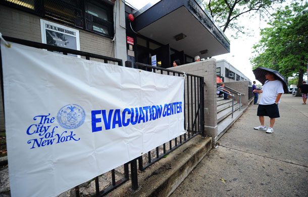 A man stands in front of an evacuation center in Brooklyn, ahead of Hurricane Irene, in New York, August 27, 2011.  Mayor Michael Bloomberg on Saturday urged some 370,000 New Yorkers to heed mandatory evacuation orders and leave "right now," as Hurricane Irene approached, threatening a massive flood surge. (AFP)