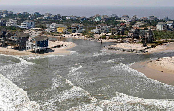 The road is washed out on the north end of  route 12 in the Rodanthe area on Hatteras Island, NC, Sunday, Aug 28, 2011.  Hurricane Irene swept through the area Saturday cutting the roadway in five locations. (AP)