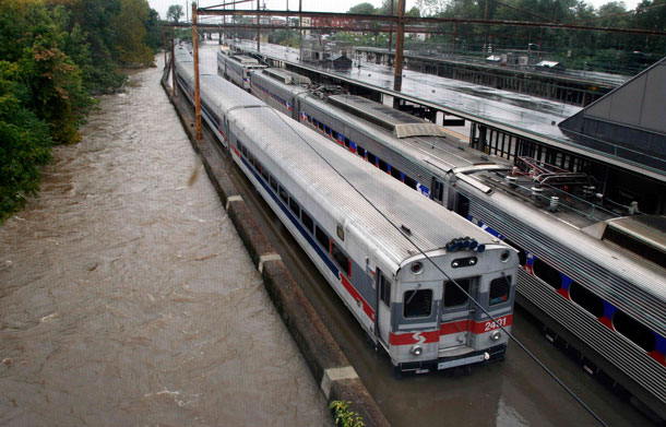 Two Southeastern Pennsylvania Transportation Authority trains sit in water on flooded tracks at Trenton train station Sunday, Aug 28, 2011, in Trenton, NJ, as rains from Hurricane Irene are causing inland flooding of rivers and streams. (AP)