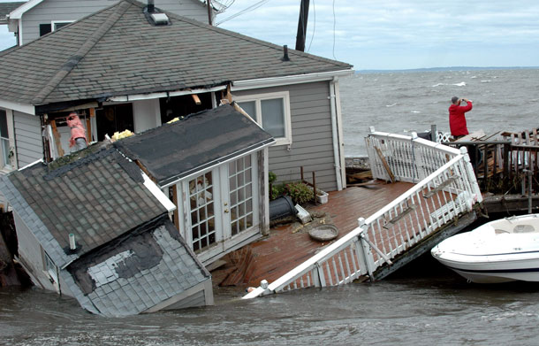 A Fairfield Beach Road is submerged in Pine Creek in Fairfield, Conn. as treacherous weather caused by Tropical Storm Irene came through the area on Sunday Aug 28, 2011. Tropical Storm Irene sent sea water flooding into shoreline communities and destroyed oceanfront homes as it surged across Connecticut on Sunday, toppling trees and cutting power to nearly half the state. (AP)