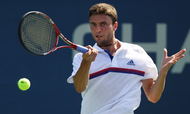 Gilles Simon of France returns a shot to Guillermo Garcia-Lopez of Spain during the US Open tennis tournament in New York, Friday, Sept 2, 2011. (AP)