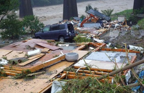 Debris of a destroyed house at Totsukawa village in Nara prefecture, western Japan. Typhoon Talas cut across western Japan September 3 leaving at least eight people dead and 33 missing after heavy rains and fierce winds, officials and press reports said. (AFP)