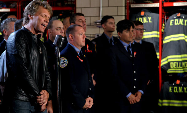 Jon Bon Jovi performes a rendition of America The Beautiful at the NYFD Battalion 8, Engine 8, Ladder 2 fire house Wednesday, Sept 7, 2011 in New York to pay tribute to 9/11 first responders. The performance will air during a special "NFL Kickoff 2011: Back to Football" show on NBC Saturday night at 8 PM. (AP)
