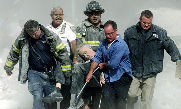 Police, firemen and a civilian carry the body of FDNY Chaplain Mychal Judge after he was killed in the collapse of the south tower at the World Trade Center in New York September 11, 2001 file photo. September 11th marks the 10th anniversary of the 9/11 attacks where nearly 3,000 people died when four hijacked airliners were used in coordinated strikes on the Pentagon and the World Trade Center towers. The fourth plane crashed in Pennsylvania. (REUTERS)