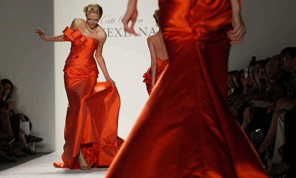 A model steps on her dress while presenting a creation from the Venexiana Spring/Summer 2012 collection during New York Fashion Week September 10, 2011. (REUTERS)