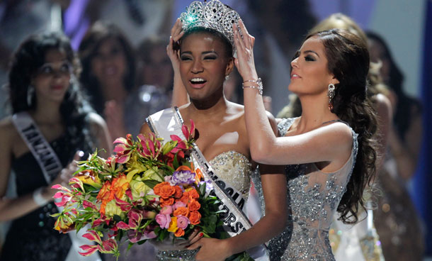 Miss Angola Leila Lopes, left, is crowned Miss Universe 2011 by Miss Universe 2010 Ximena Navarrete, of Mexico, in Sao Paulo, Brazil, Monday Sept 12, 2011. (AP)
