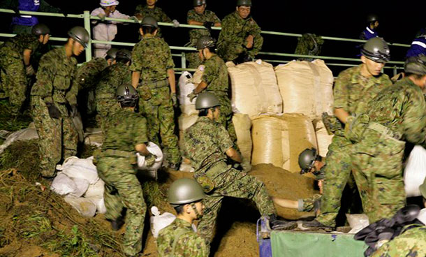 apan Ground Self-Defence Force soldiers place sandbags to reinforce embankments on Hatta river to prevent further damage due to typhoon Roke in Kasugai, central Japan in this handout photo taken on early September 21, 2011. At least four people died and two were missing in Japan as typhoon Roke bore down on Tokyo on Wednesday, bringing heavy rain and strong winds. (REUTERS)