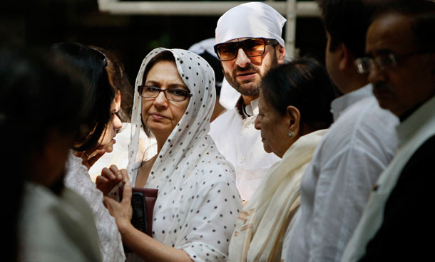 Bollywood actor and wife Sharmila Tagore, center left, and son Saif Ali Khan, center right, attend the funeral of Mansur Ali Khan Pataudi in New Delhi, India, Friday, Sept. 23, 2011. Pataudi, a former India cricket captain who led the country to its first series victory abroad, died Thursday at a local hospital where he was being treated for a lung disease. He was 70. (AP)