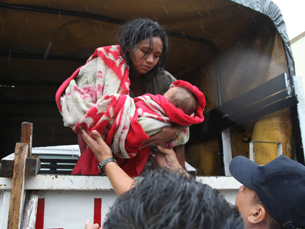 Typhoon Nesat, with winds of up to 133 miles (215 kilometers), slammed the northeastern Philippines Tuesday, unleashing floods, cutting power, halting work in the capital and forcing thousands of residents to flee to evacuation centers. (AP)