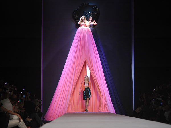 PARIS, FRANCE - OCTOBER 01:  A model walks the runway as Les Brigittes perform during the Viktor&Rolf Ready to Wear Spring / Summer 2012 show during Paris Fashion Week at Espace Ephemere Tuileries on October 1, 2011 in Paris, France.  (GETTY)