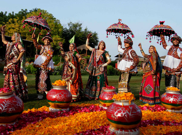 Indians wearing traditional attire perform Garba, a traditional dance of western Indian state of Gujarat, as part of preparation for Navratri festival in Ahmadabad, India, Friday, Sept. 23, 2011. (AP)
