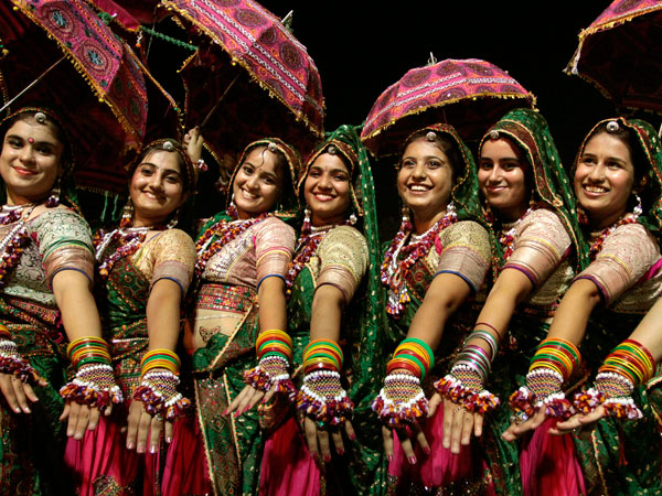 Indian women in traditional attire take part in Garba, a traditional dance of western Indian state of Gujarat, on the second night of the nine-night festival "Navratri" in Ahmadabad, India, Thursday, Sept. 29, 2011. (AP)