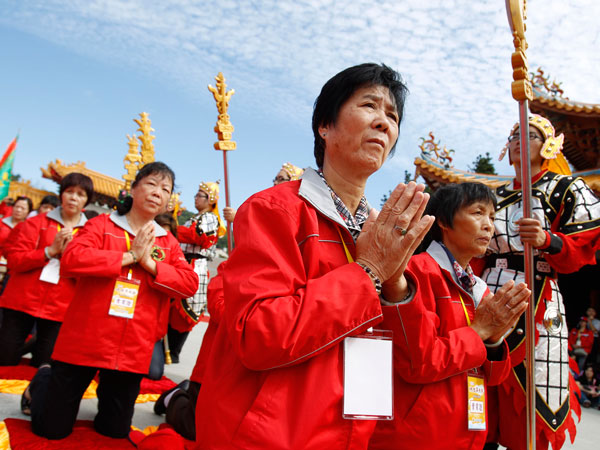 Worshippers pray during a celebration of Matsu, the Chinese goddess of the sea on Nangan Island in Taiwan's outlying Matsu Island chain, Wednesday, Oct. 5, 2011. (AP)