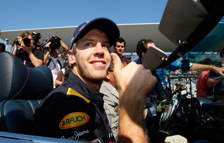 Red Bull Formula One driver Sebastian Vettel of Germany gestures during the driver's parade on the Suzuka Circuit  prior to the Japan Formula One Grand Prix on Sunday. (AP)