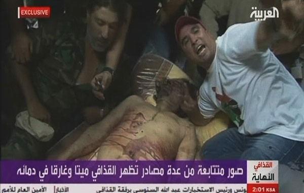 In this image taken from a video footage by Al-Arabiya television, the body of former Libyan leader Muammar Gaddafi is seen in a morgue in Sirte, Libya, on Thursday, Oct. 20, 2011 (AP)