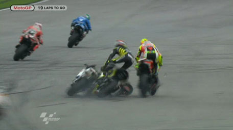 In this image made from video provided by Dorna Sports S.L., Italy's Marco Simoncelli, center back, collides with USA's Colin Edwards, second from right, and Italy's Valentino Rossi, right, on turn 11 of the Malaysian MotoGP Grand Prix in Sepang, Malaysia, Sunday, Oct. 23, 2011. Italian rider Marco Simoncelli died of chest, head and neck injuries Sunday after a crash at the Malaysian MotoGP motorcycle race, organizers said. He was 24. (AP)