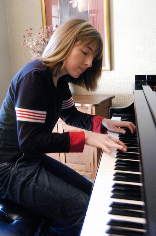 In this March 17, 2005, photo Hillary Adams, the daughter of Aransas County Court-at-Law Judge William Adams, practices the piano at her home in Rockport, Texas. Williams Adams told a Corpus Christi television station the video secretly recorded in 2004 looks &ldquo;worse than it is.&rdquo; The video shows Adams violently whipping his daughter, Hillary, in the legs more than a dozen times, while she screams and refuses to turn over on a bed to be beaten (AP)