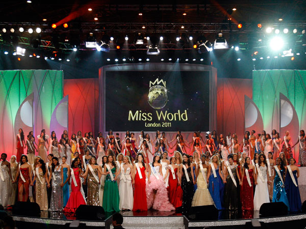 Miss Venezuela Ivian Sarcos, center, sings on stage with her fellow contestants after she is announced the winner of the Miss World competition at Earls Court in London, Sunday, Nov. 6, 2011. (AP)