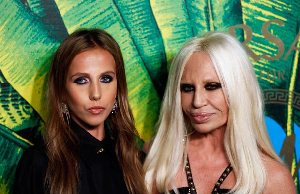 Designer Donatella Versace (L) arrives with her daughter Allegra at a party to celebrate the upcoming launch of the Versace for H&M collection in New York. (REUTERS)