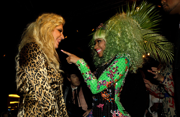 Singer Nicki Minaj, right, and Ke$ha speak during the Versace for H&M launch fashion show in New York. (AP)