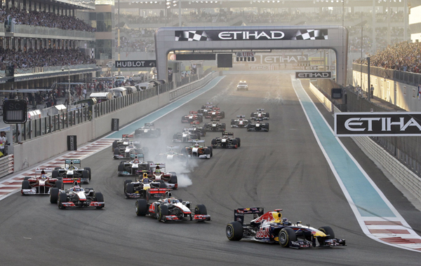 Red Bull driver Sebastian Vettel of Germany leads the field after the start during  the Emirates Formula One Grand Prix at the Yas Marina racetrack , in Abu Dhabi, United Arab Emirates, Sunday, Nov.13, 2011. (AP)