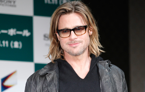 Actor Brad Pitt poses for photos prior to a press conference of his latest film "Moneyball" in Tokyo Thursday, Nov. 10, 2011. (AP)