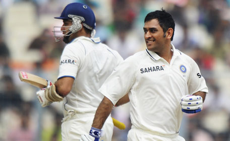 Indian cricket captain Mahendra Singh Dhoni( R) and VVS Laxman complete a run during the second day of the second Test match between Indian and West Indies at The Eden Gardens in Kolkata on November 15, 2011. India declared their first innings closed at 631-7 after tea on the second day of the second Test against the West Indies. (AFP)
