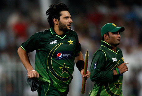 Pakistan's Shahid Afridi (left) celebrates his team's victory against Sri Lanka during the fourth one-day international in Sharjah on Sunday. (REUTERS)