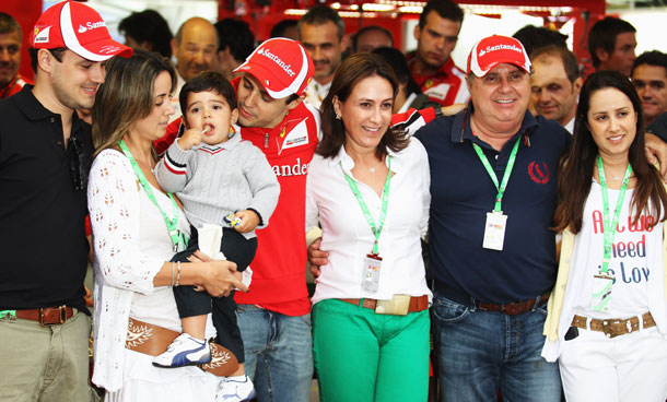 Felipe Massa (C) of Brazil and Ferrari is seen with family, friends and team mates past and present as he celebrates 10 years in F1 and 100 races for Ferrari following qualifying for the Brazilian Formula One Grand Prix at the Autodromo Jose Carlos Pace on November 26, 2011 in Sao Paulo, Brazil. (GETTY)