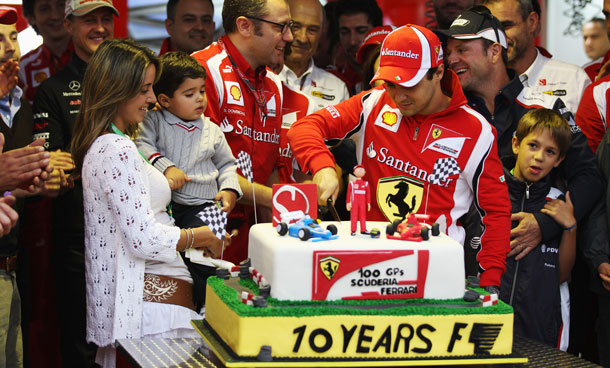 Felipe Massa of Brazil and Ferrari is seen with family, friends and team mates past and present as he celebrates 10 years in F1 and 100 races for Ferrari following qualifying for the Brazilian Formula One Grand Prix at the Autodromo Jose Carlos Pace on November 26, 2011 in Sao Paulo, Brazil. (GETTY)