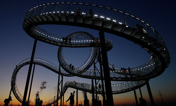 The sculpture 'Tiger and Turtle' in Duisburg, Germany was designed by Heike and Ulrich and looks like a roller coaster. Creators of the &euro;2million project say 'The roller coaster stands for acceleration and high speed of a tiger but the visitor has to explore it step by step like a turtle.' 40 visitors at a time can enjoy the views from 85m via 249 steps. (AP)