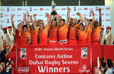 England team with the Emirates Cup after winning the Emirates Airline Dubai Rugby Sevens tournament at The Sevens stadium in Dubai on Saturday. (PATRICK CASTILLO)