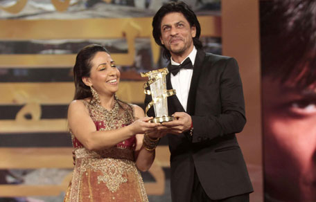 Bollywood star Shah Rukh Khan receives a tribute for his career from Moroccan actress Houda Rihani during the opening ceremony of the 11th Marrakech International Film Festival (FIFM) December 2, 2011. The festival runs from December 2 to 10. (REUTERS)