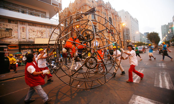 French street theatre company, Generik Vapeur perform "Lima Rueda", an artistic parade at San Martin's square in downtown Lima, December 4, 2011. The parade seek to promote the use of bicycles in the city. (REUTERS)