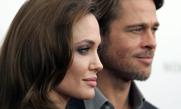 Angelina Jolie and Brad Pitt arrive at the screening of her directorial debut "In the Land of Blood and Honey" in New York December 5, 2011. (REUTERS)