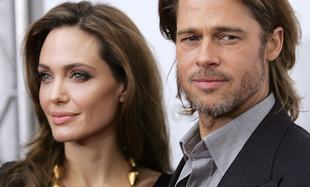 Angelina Jolie and Brad Pitt arrive at the screening of her directorial debut "In the Land of Blood and Honey" in New York December 5, 2011. (REUTERS)
