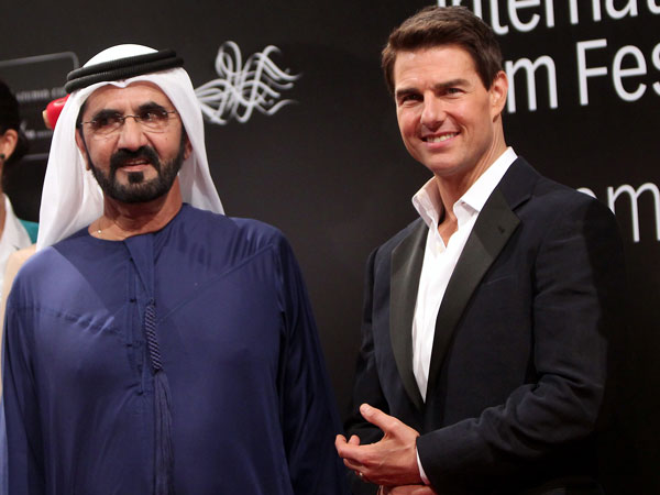 His Highness Sheikh Mohammed bin Rashid Al Maktoum, Vice-President and Prime Minister of the UAE and Ruler of Dubai with US actor Tom Cruise (R) poses on the red carpet upon their arrival to the opening ceremony of the Dubai International Film Festival (DIFF) in the Gulf emirate on December 7, 2011. (AFP)