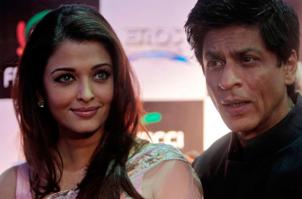 Bollywood actors Shah Rukh Khan, right, and Aishwarya Rai Bachchan pose for the media during FICCI frames 2011 in Mumbai, India, Friday, March 25, 2011. (AP)