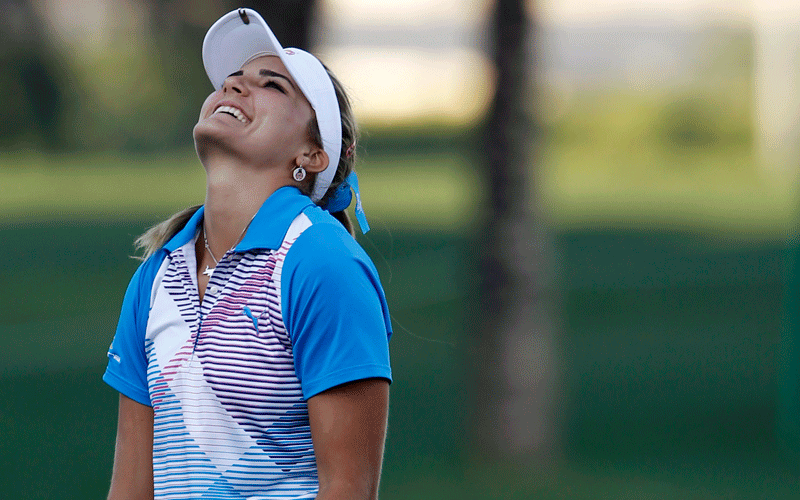 Alexis Thompson of the US reacts at the 18th green during the final round after winning the Dubai Ladies Masters European Tour at the Emirates golf club in Dubai. (REUTERS)