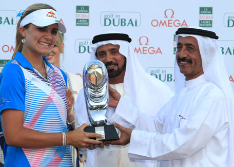 Omega Dubai Ladies Masters winner Alexis Thompson receiving the trophy from Sheikh Hasher Maktoum bin Juma Al Maktoum, Director General of Dubai Department of Information, while Mohamed Juma Buamaim, CEO of 'golf in Dubai' looks on. (PATRICK CASTILLO)