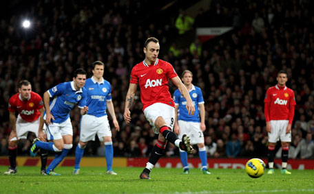 Dimitar Berbatov of Manchester United scores his team's fifth goal from a penalty to complete his hat trick during the Barclays Premier League match against Wigan Athletic at Old Trafford on Monday in Manchester, England. (GETTY)