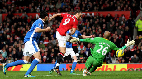 Dimitar Berbatov of Manchester United scores the opening goal during the Barclays Premier League match against Wigan Athletic at Old Trafford on Monday in Manchester, England. (GETTY)