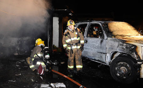 Firefighters battle a three-alarm apartment fire that started in the carport and spread into nearby units late Saturday night in Glendale, California. Firefighters in Los Angeles were steeling themselves for a busy New Year's eve on Saturday, following a rash of arson fires that saw more than 30 cars torched in recent days. Authorities are on the lookout for at least one suspect amid fears more blazes could result in serious injury. (REUTERS)