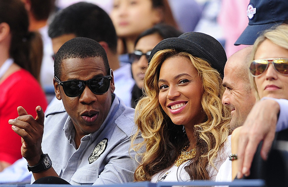 US singers Jay-Z and Beyonce watching Spanish tennis player Rafael Nadal play Serbia's Novak Djokovic in the men's US Open 2011 final at the USTA Billie Jean King National Tennis Center in New York. (AFP)