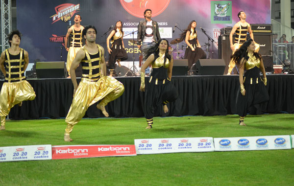 Singer Devi Prasad belting it out with a troop of enthusiastic dancers during the opening ceremony of Celebrity Cricket League at the Sharjah Cricket Stadium, January 13, 2012. (KAMRAN)