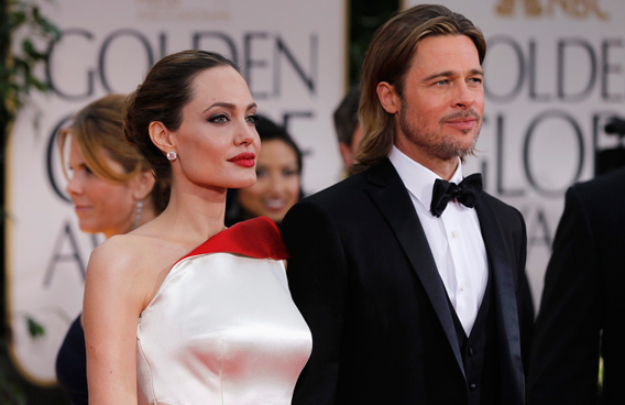 Actress and director Angelina Jolie (L) and actor Brad Pitt arrive at the 69th annual Golden Globe Awards in Beverly Hills, California. (REUTERS)