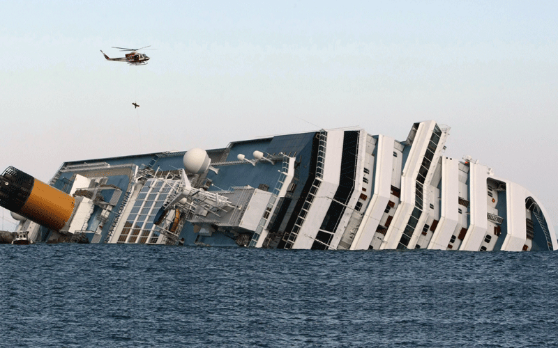 A helicopter evacuate Marrico Giempietroni, the Costa Concordia's cabin service director after he was rescued from the Costa Concordia on January 15, 2012, after the cruise ship ran aground and keeled over off the Isola del Giglio, late on January 13. Three people died and several were missing after the ship with more than 4,000 people on board ran aground sparking chaos as passengers scrambled to get off. Two South Korean honeymooners were rescued early today from the cruise as emergency crews searching for dozens missing. (AFP)